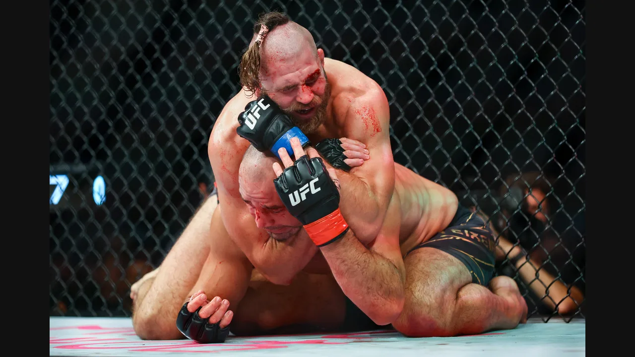Photograph of two UFC fighters grappling on the canvas inside the octagon